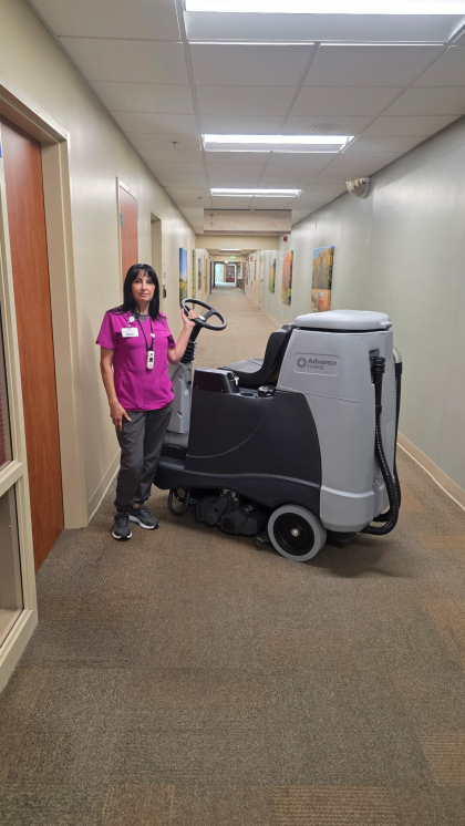 Employee with Carpet Extractor