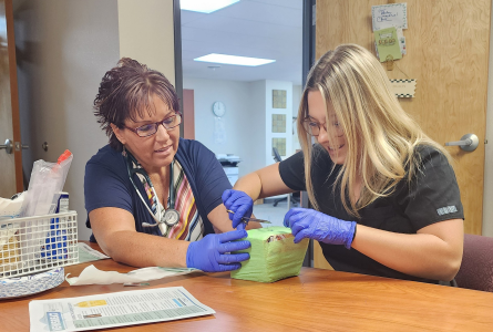 UNK Student learning from Teresa Hodgson, PA-C