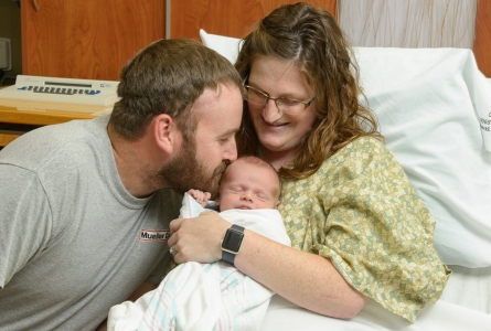 parents with new born baby